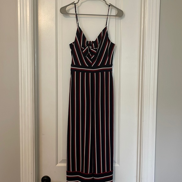A fun and flirty navy jumpsuit with red/white accents! - Picture 1 of 3